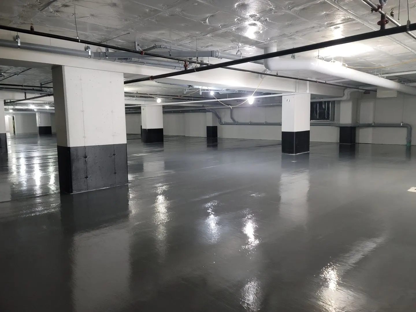 Why Parking Garages Need a Waterproofing Membrane, Not Just a Topcoat